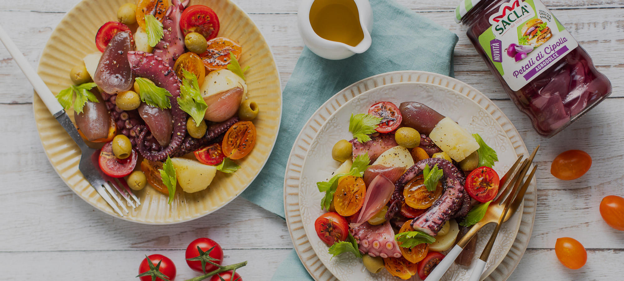 Insalata di polpo e patate con Petali di Cipolla, foglie di sedano, pomodorini e Olive Verdi Snocciolate
